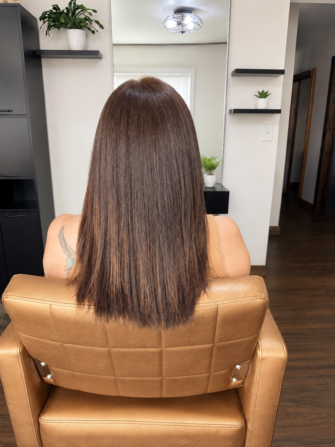 After photo showing sleek, glossy hair following a Brazilian Blowout smoothing treatment by Hayley