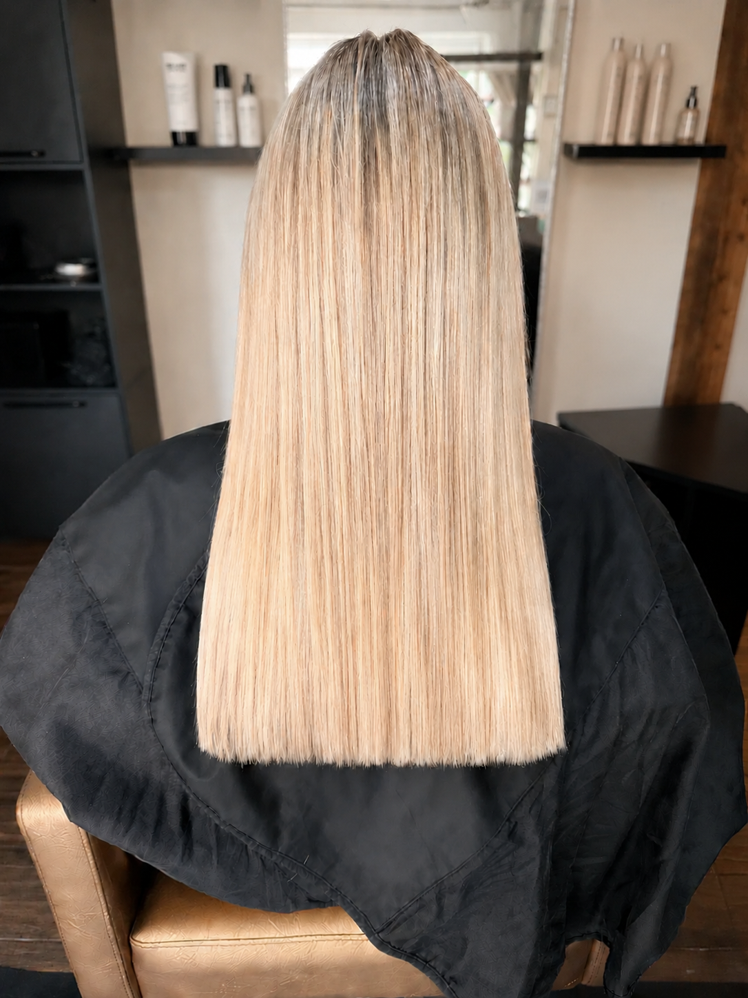 After back view showing smooth blonde hair following a keratin smoothing treatment